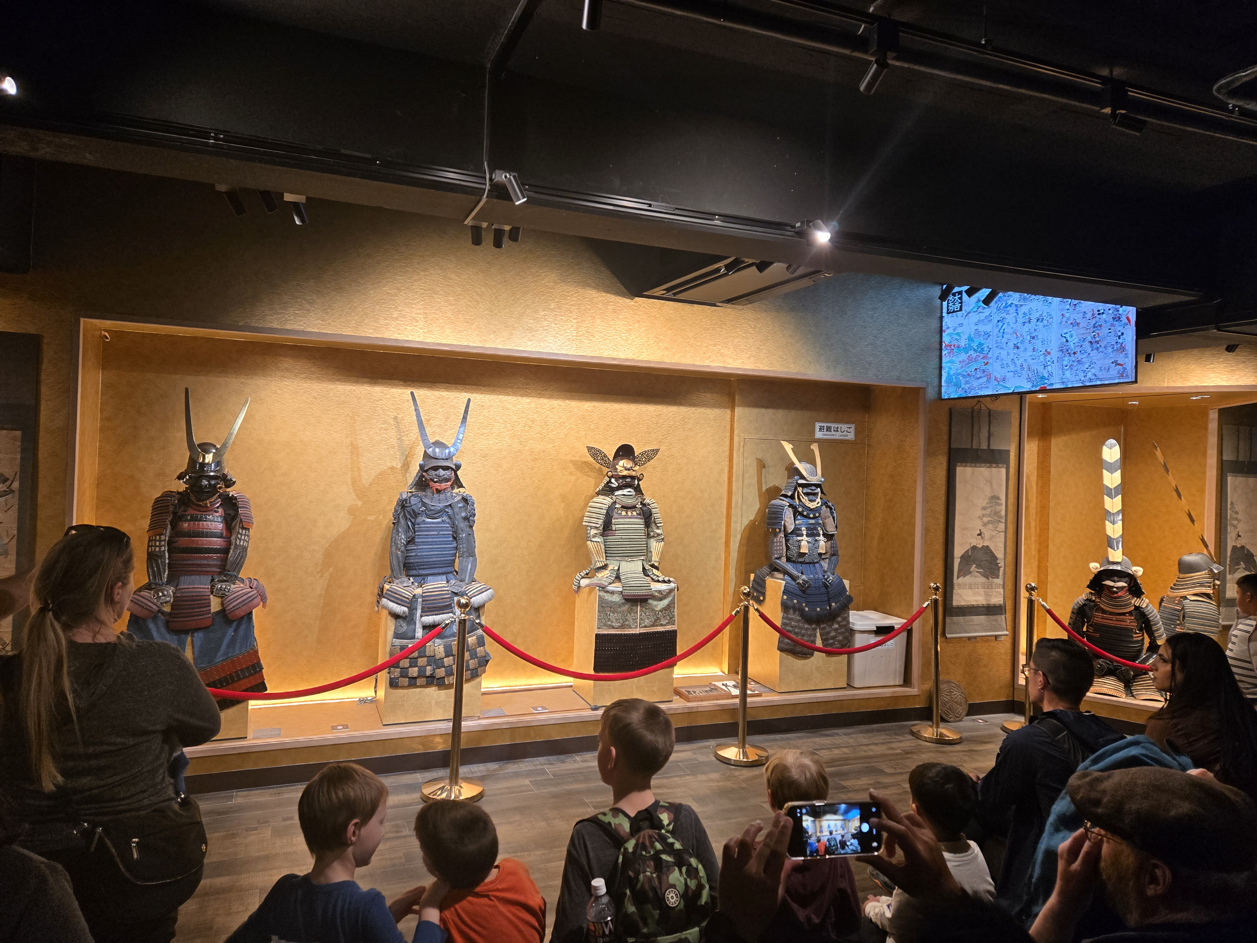 A photo of the armour hall in the museum. The more-ornate and detailed the armour was, the higher-ranked the samurai was.