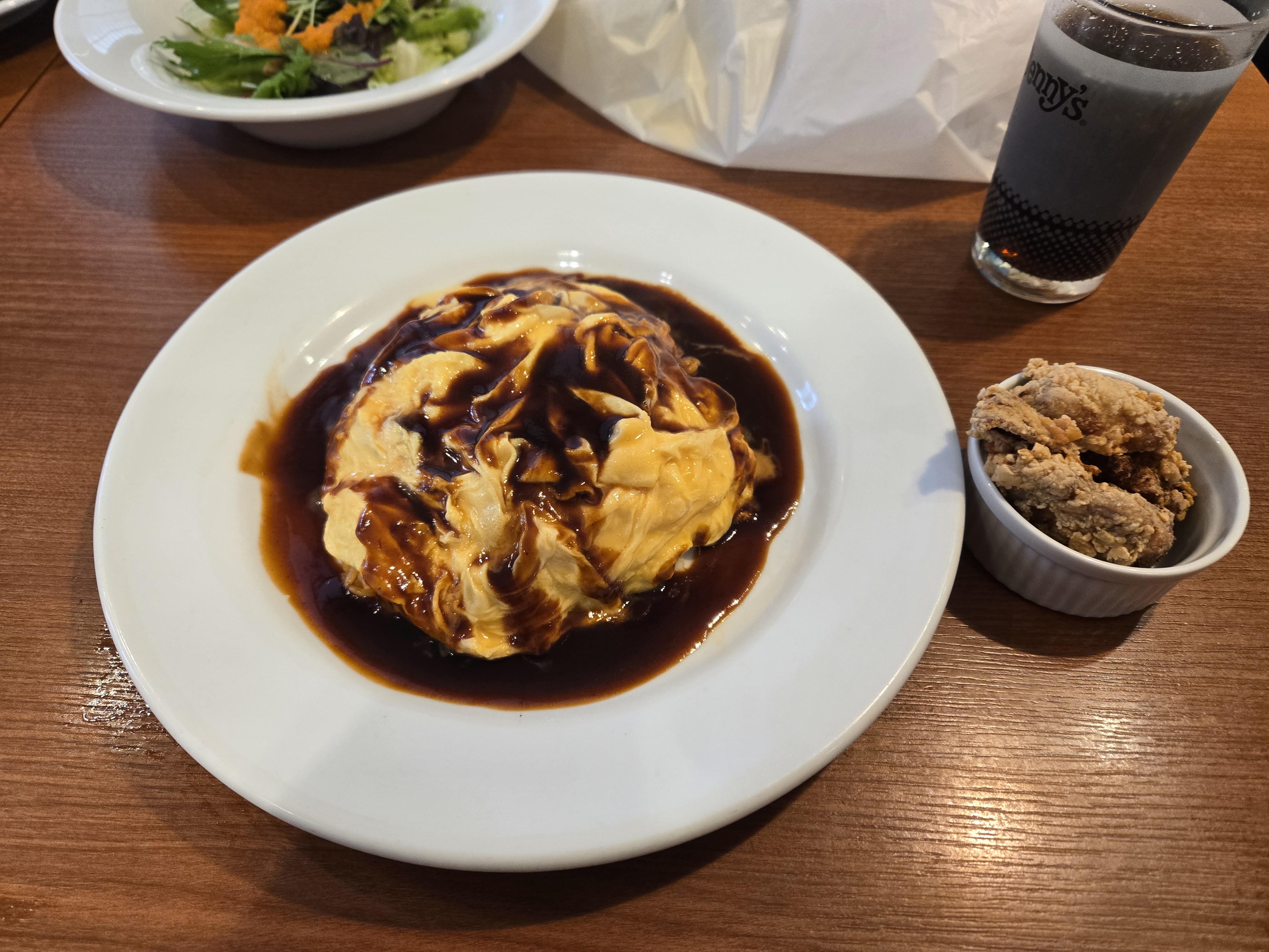 A photo of the omelette with rice and gravy that was for lunch.