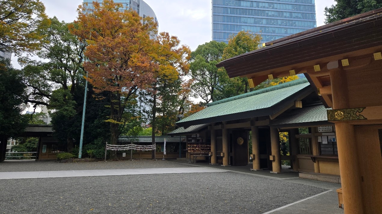 A photo of an ornate Japanese temple surrounded by greenery.