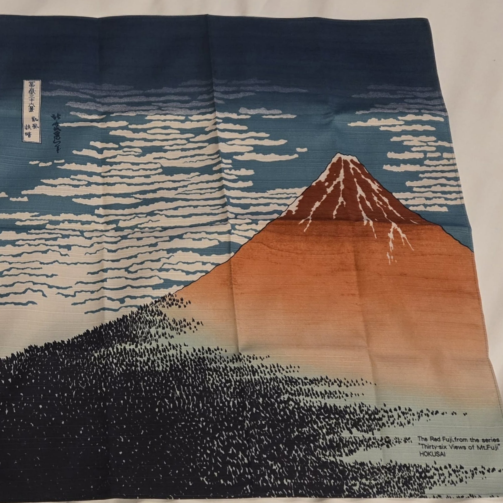 A photo of a Japanese tenugui, a type of screenprinted fabric.