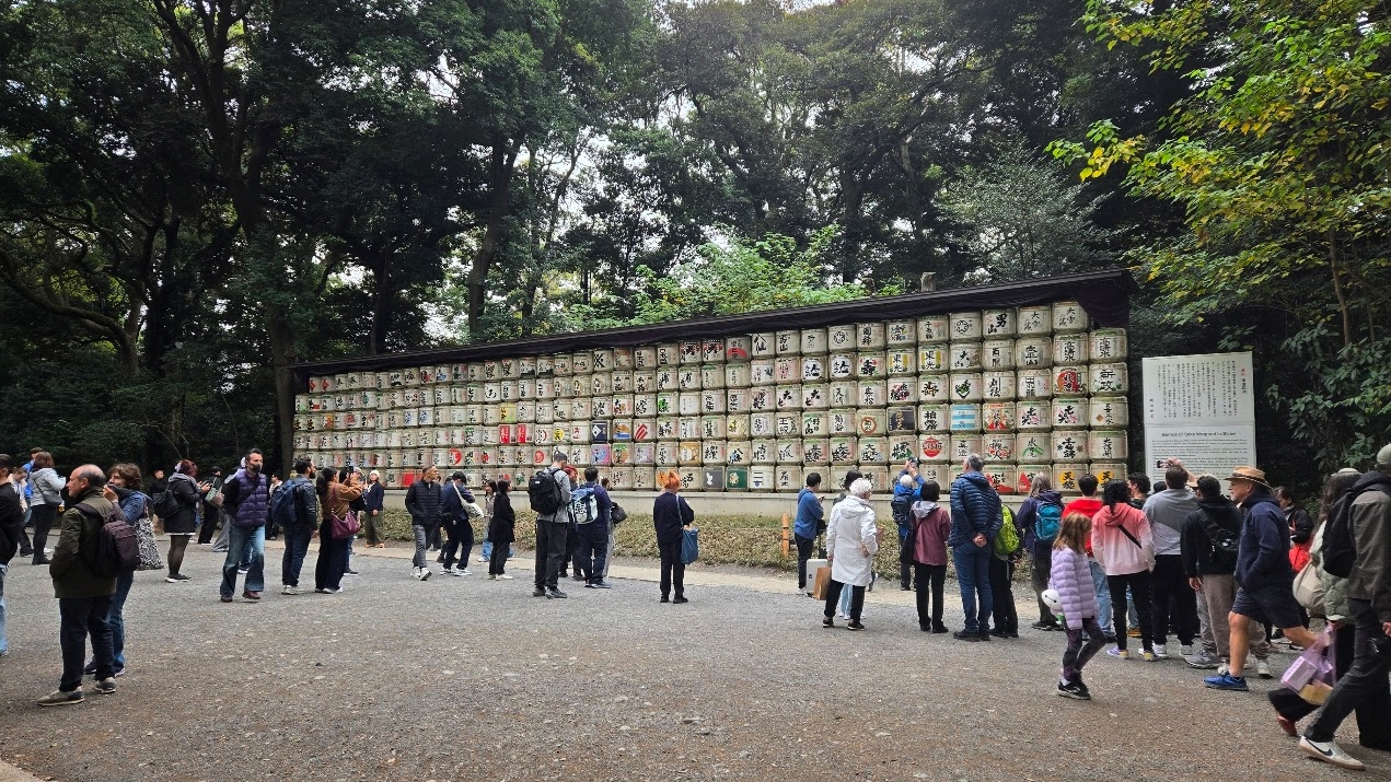 A photo of a wall of barrels.