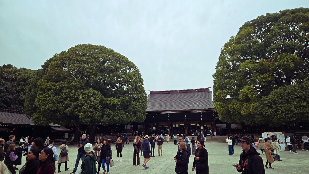 A photo of a wide open courtyard in front of a large temple building.